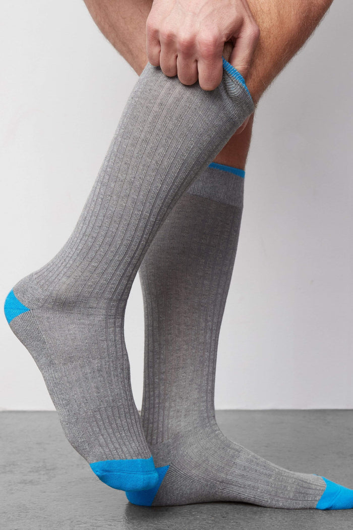 Side view of a man wearing Everyday Extended Crew Sock in Grey Heather