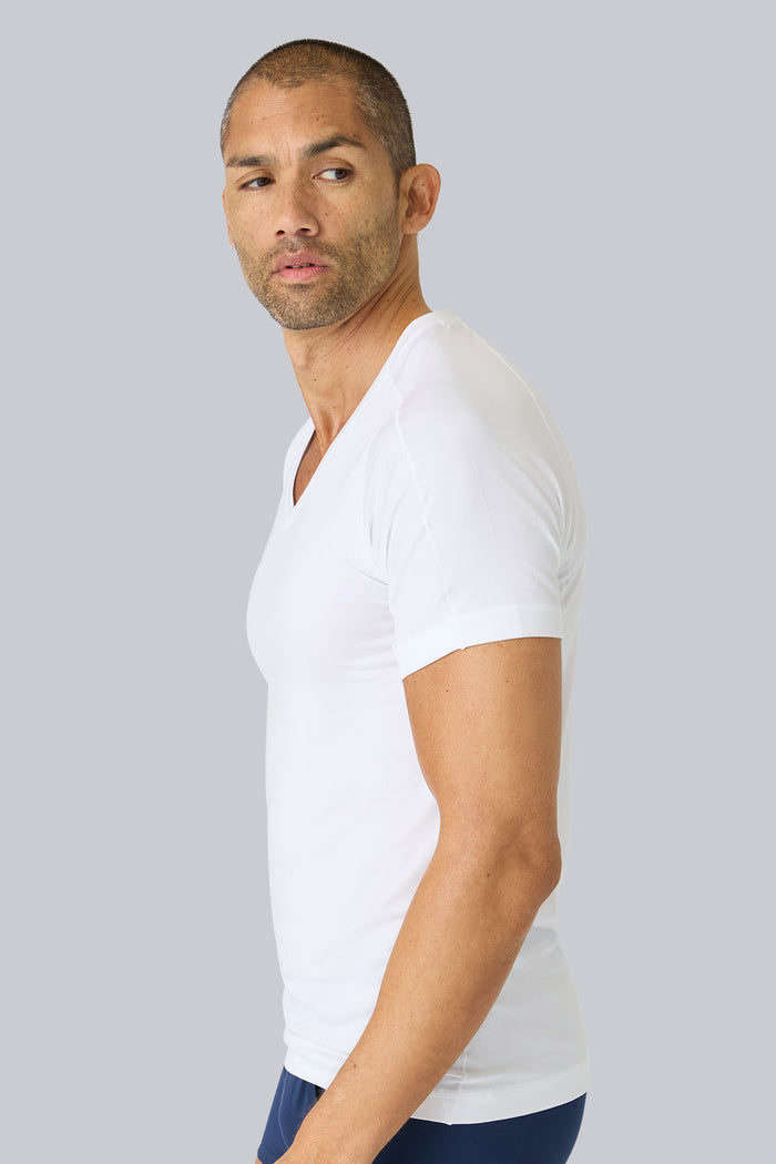 Side view of a man wearing 18HR V-neck Undershirt in Bright White