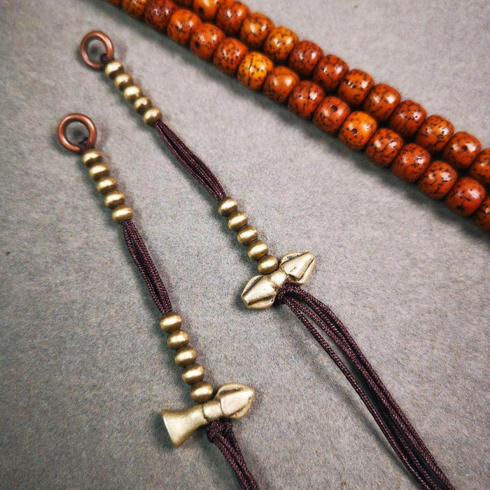4mm Brass Prayer Bead Counters with Dorje Bell Pendant - Tibetan Buddhist art, close-up detail