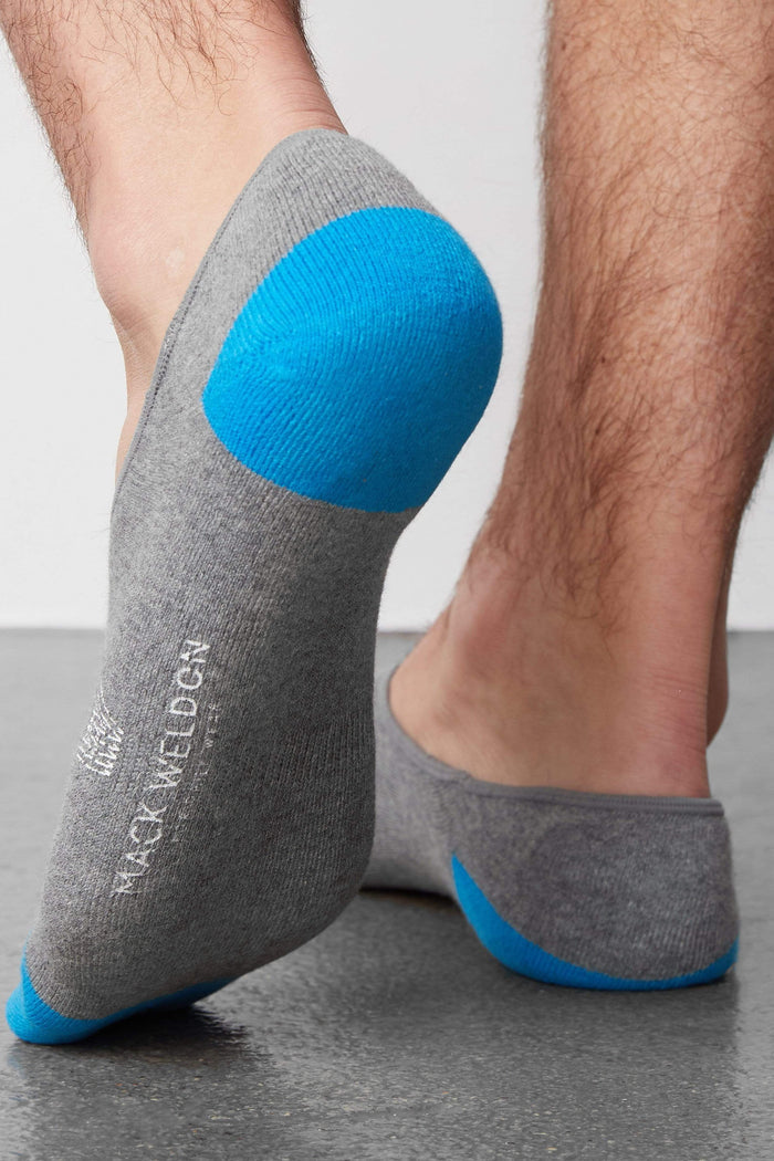 Back view of a man wearing Everyday No Show Sock in Grey Heather
