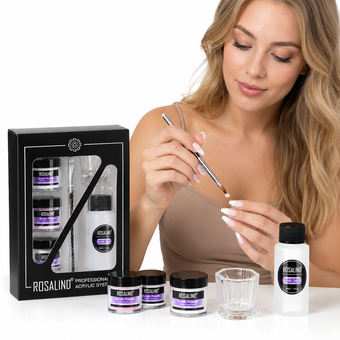 Acrylic nail kit arranged with three powder jars, liquid monomer, glass cup and carving pen for home nail extensions and art.