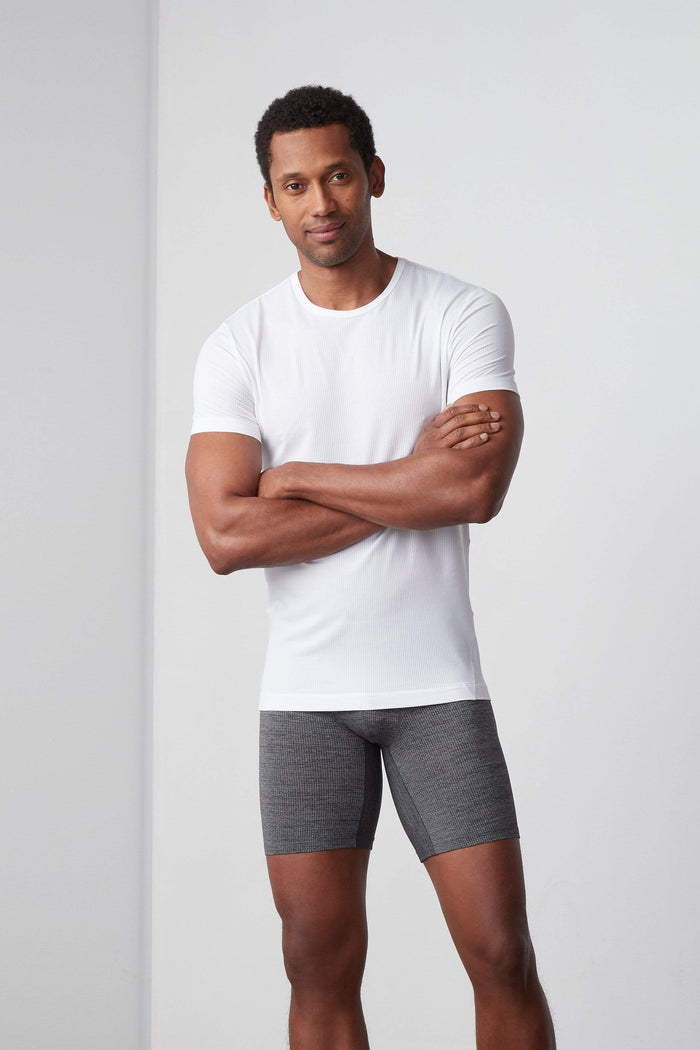 Full body front view of a man wearing AIRKNITx Crew Neck Undershirt in Bright White