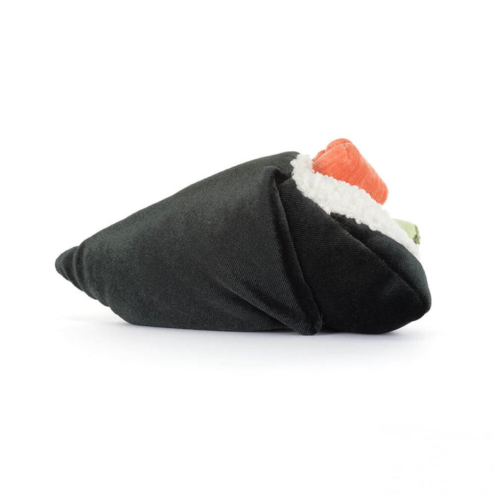 Side view of the Jellycat Amuseables Coneroi Temaki plush toy lying on its side, showing the cone-shaped nori wrap with salmon and rice filling peeking out the top, on a white background