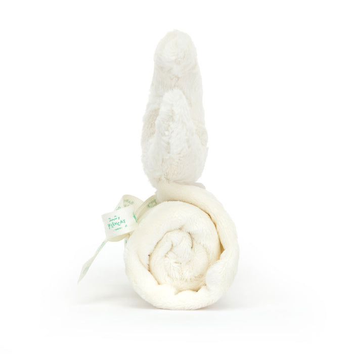 White crescent moon plush toy on a white background, viewed from the side