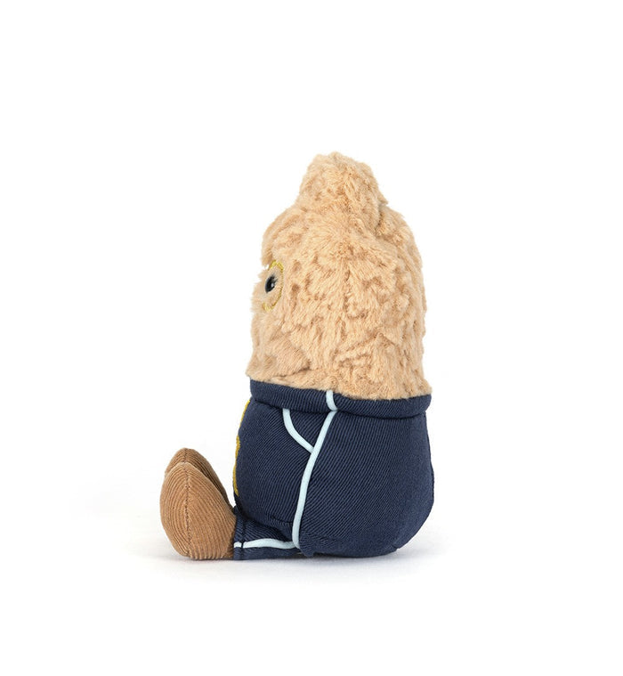 Small plush toy with a beige head and navy body on a white background, viewed from the side