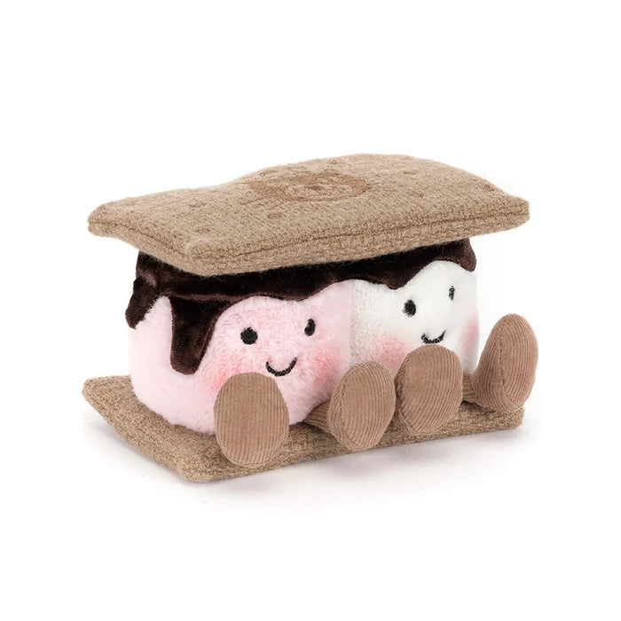 Plush toy resembling a s'more with marshmallows and chocolate on a white background