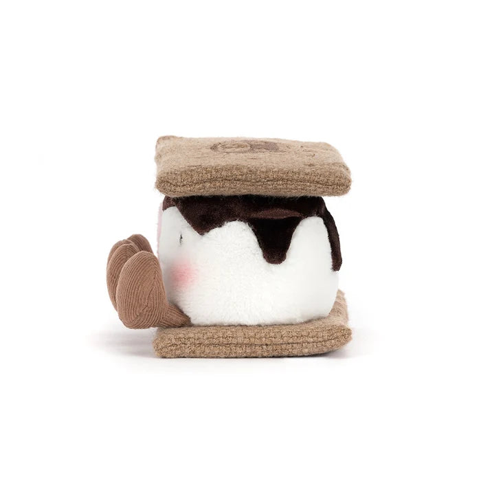 Small plush toy resembling a s'more on a white background as seen from the side