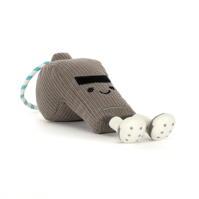 Plush toy resembling a grey metal whistle with a smiling face and two white feet on a white background.