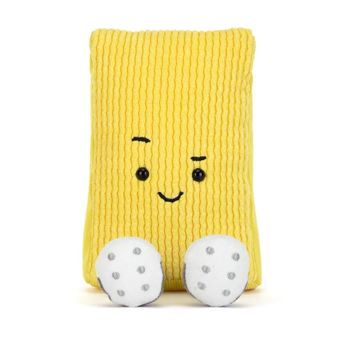Yellow plush toy in the shape of a soccer yellow card with a smiling face and two white feet on a white background