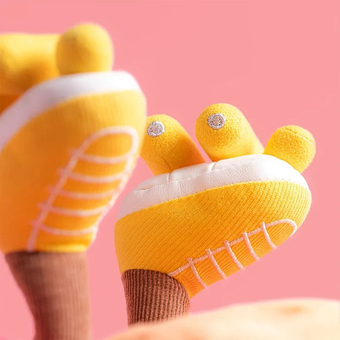 Close-up of yellow shoes with white soles on a pink background