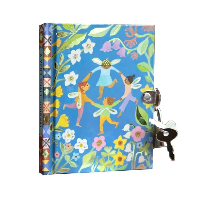 Fairy Ring journal by Eeboo with an illustration of fairies dancing among flowers, blue cover