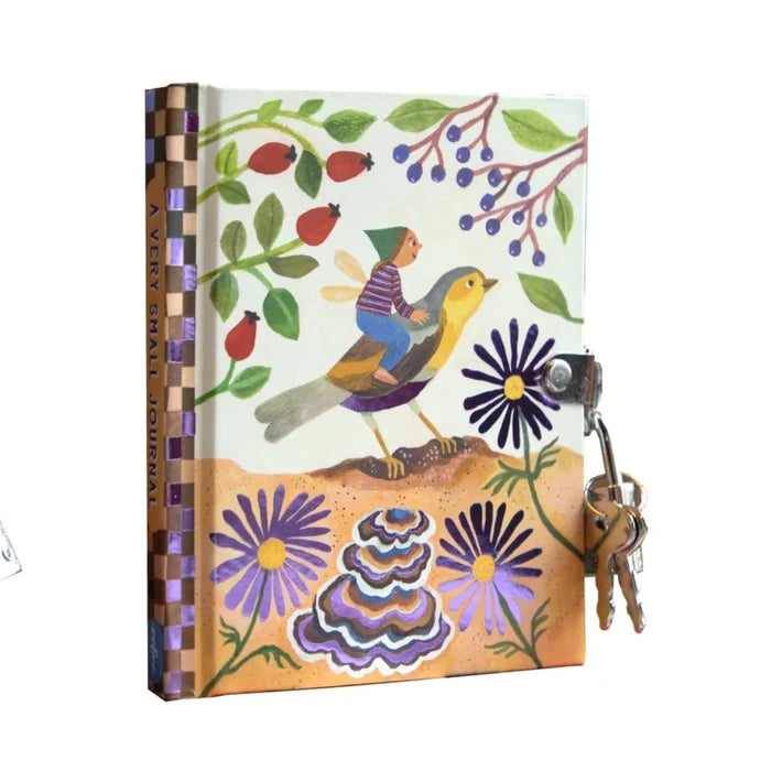Song Bird Friend journal by Eeboo with an illustration of fairy child riding a songbird among purple flowers