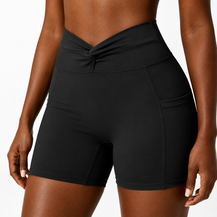 Close-up of Classic Black women's bike shorts showing twist-front waistband, smooth fabric, seams and side pocket
