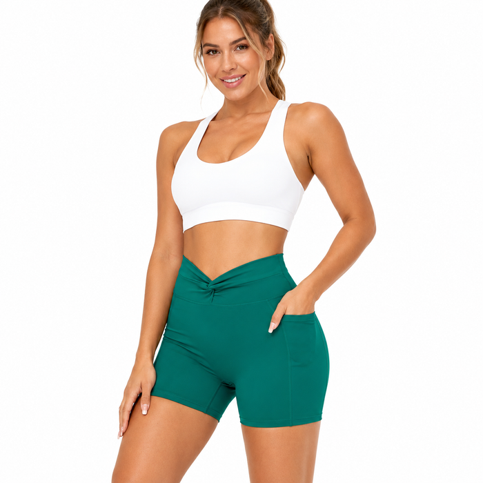 Sea Green women's bike shorts highlighting the twist-front waistband, fitted shape and functional side pocket
