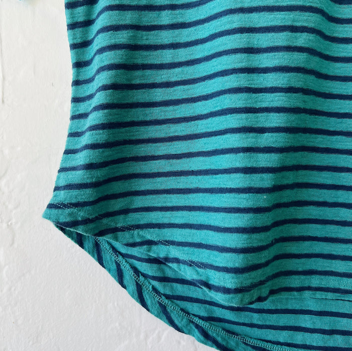 Close-up of teal and navy striped fabric on a white background