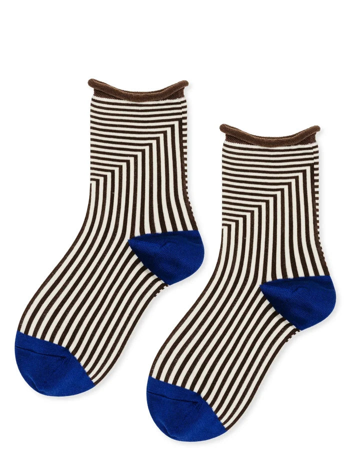 Corbusier Crew socks in Brown — graphic black and white op-art stripe with brown rolled cuff and cobalt blue heel and toe, flat lay product shot on white background