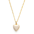 A beige heart-shaped locket on a gold-colored chain.