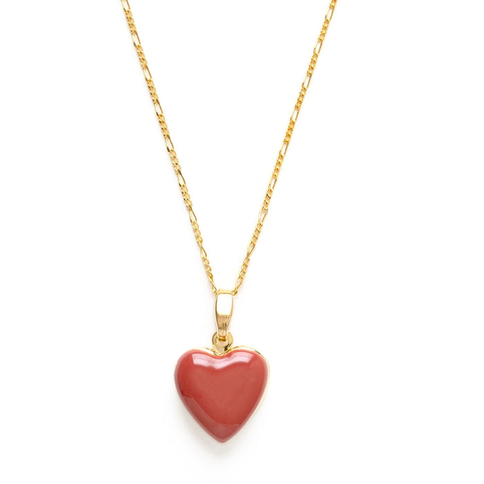 A red heart-shaped locket on a gold-colored chain.