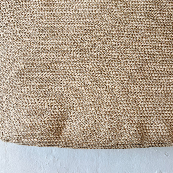 Close-up of the woven tan tweed and raffia texture on the Dotter medium tote bag