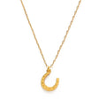 Gold horseshoe necklace on a white background