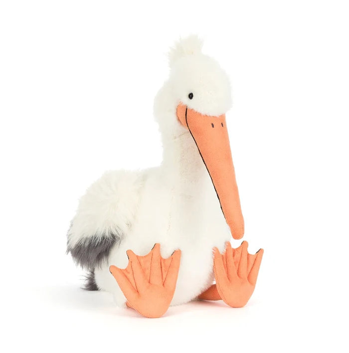 Plush pelican toy with a white body, orange beak, and feet on a white background