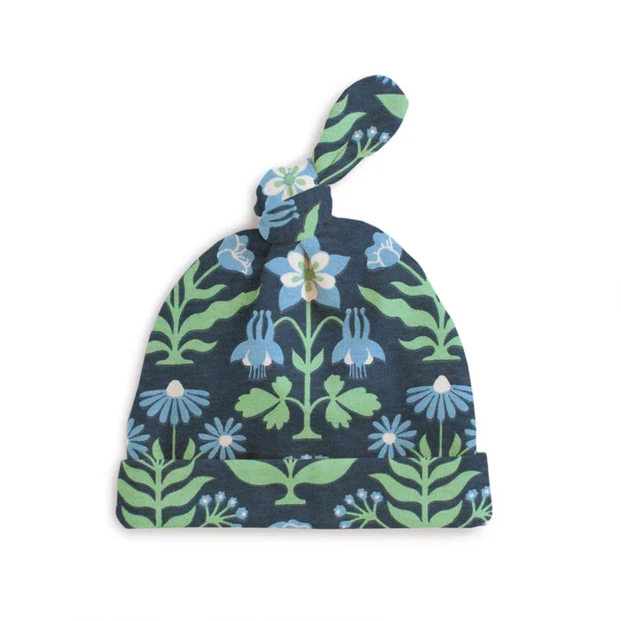 Navy blue baby hat with floral pattern on a white background
