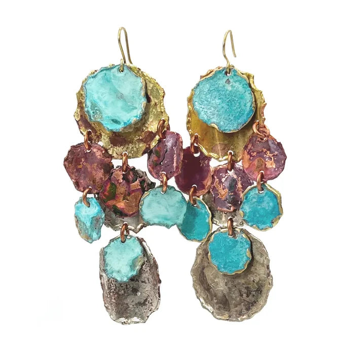 Pair of Sibilia Large Cometa Earrings in Mixed Patina, featuring a large gold and turquoise disc top with cascading irregular organic fragment drops in purple and turquoise, finishing with a large raw silver-grey textured slab, all connected by copper jump rings on gold wire hooks, on a white background
