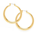 A pair of large gold-colored hoop earrings on a white background.