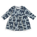 A long-sleeve baby dress with an all-over navy blue elephant pattern on a white background, laid flat against a white studio background.