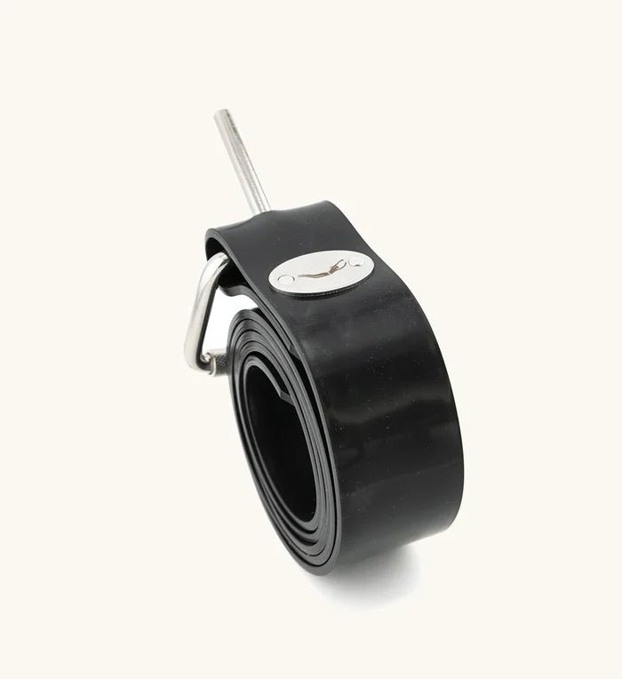 Black rubber Lava Rock Dive Belt by Bright Buoy Diving rolled into a coil, showing the stainless steel pin buckle and oval Waihana brand logo medallion against a light background.