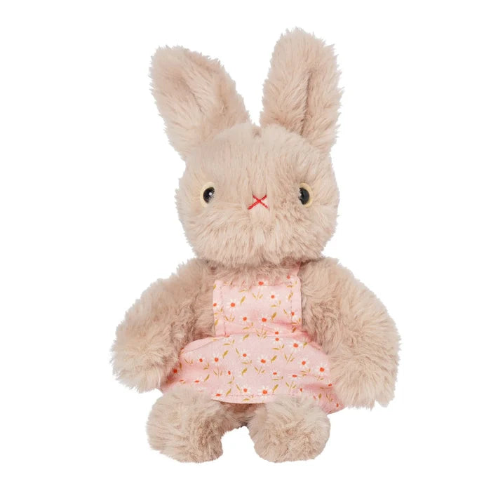 A rabbit stuffed toy in a pink floral apron