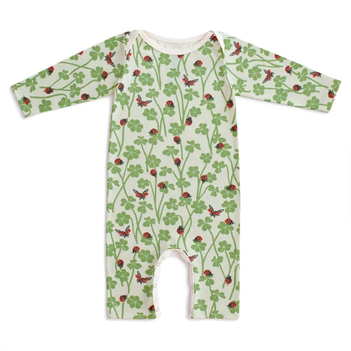 Children's onesie with a green leafy pattern on a white background