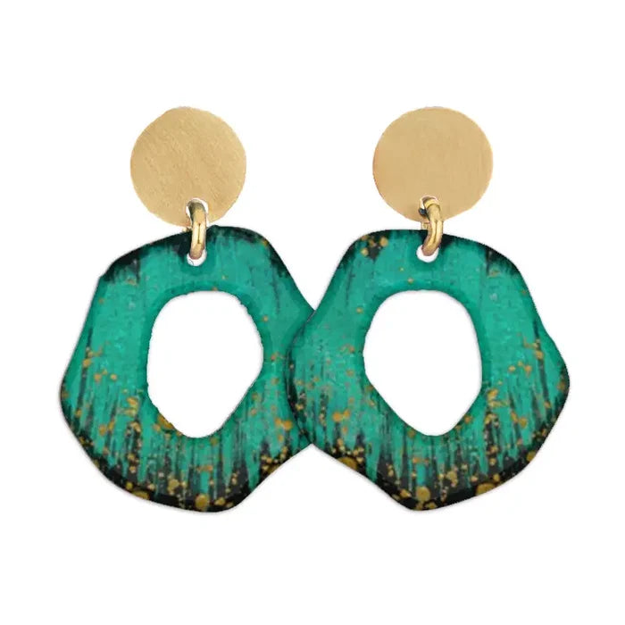 Pair of Sibilia Mancha Earrings in Forest, featuring matte gold round disc studs with large open-circle irregular drop pendants in deep forest green and black with gold speckle patina, on a white background