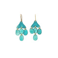 Pair of Sibilia Medusa Earrings in Turquoise Patina, featuring a turquoise patina fan-shaped top piece with five cascading oval and teardrop-shaped disc drops in vivid turquoise patina on gold jump rings, hanging from gold wire hooks, on a white background