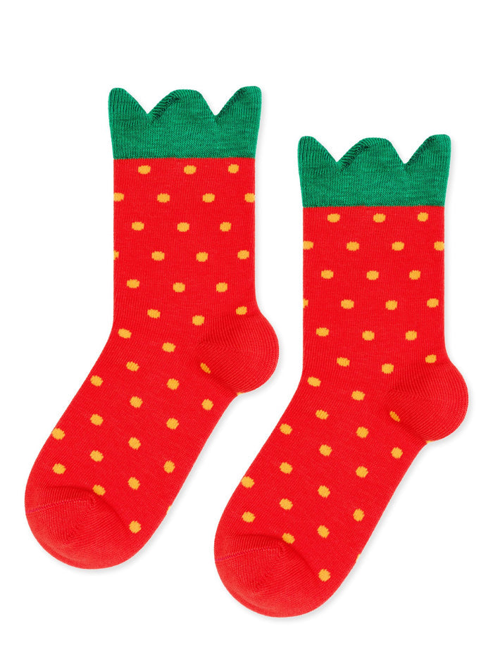A pair of red socks with yellow polka dots and green trim at the top, designed to look like strawberries.