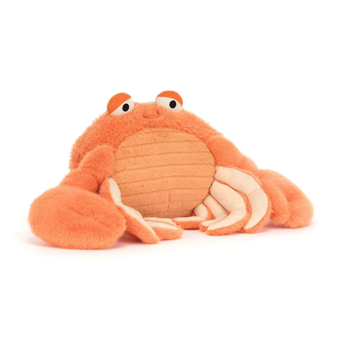 Plush orange crab toy on a white background
