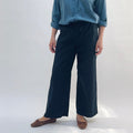 Poplin Sailor Pant in Ink — front view, wide-leg silhouette with drawstring waist, worn with a blue button-down shirt and brown flats