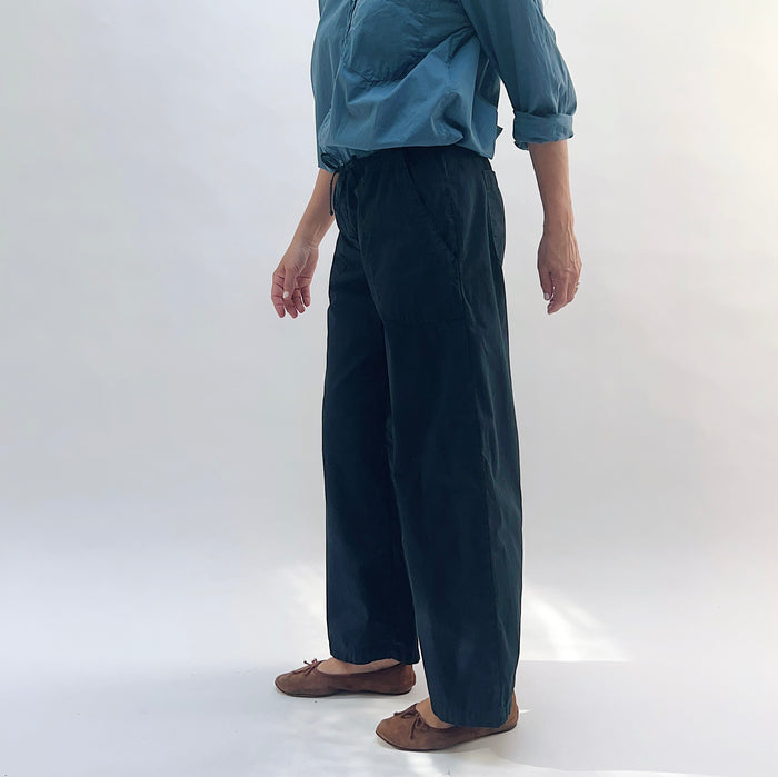 Poplin Sailor Pant in Ink — side view showing wide-leg cut and full length, styled with a blue shirt and brown flats