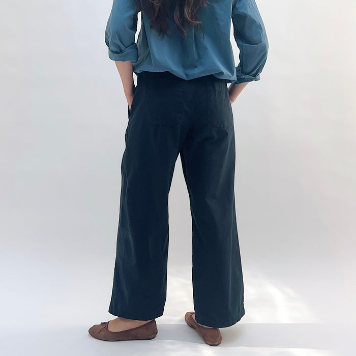 Poplin Sailor Pant in Ink — back view showing wide-leg silhouette and back pocket detail, styled with a blue shirt