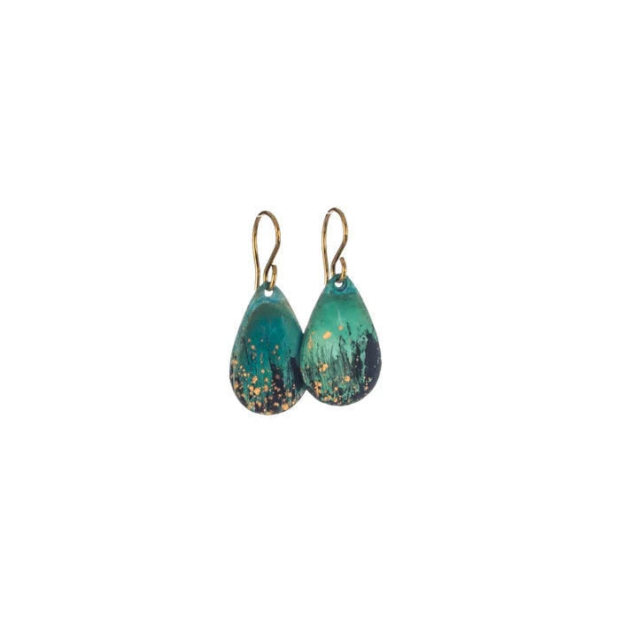 Pair of Sibilia Rain Drop Earrings in Forest, featuring teardrop-shaped treated brass drops with a deep forest green and gold speckle oxide patina finish, hanging from gold wire hooks, on a white background