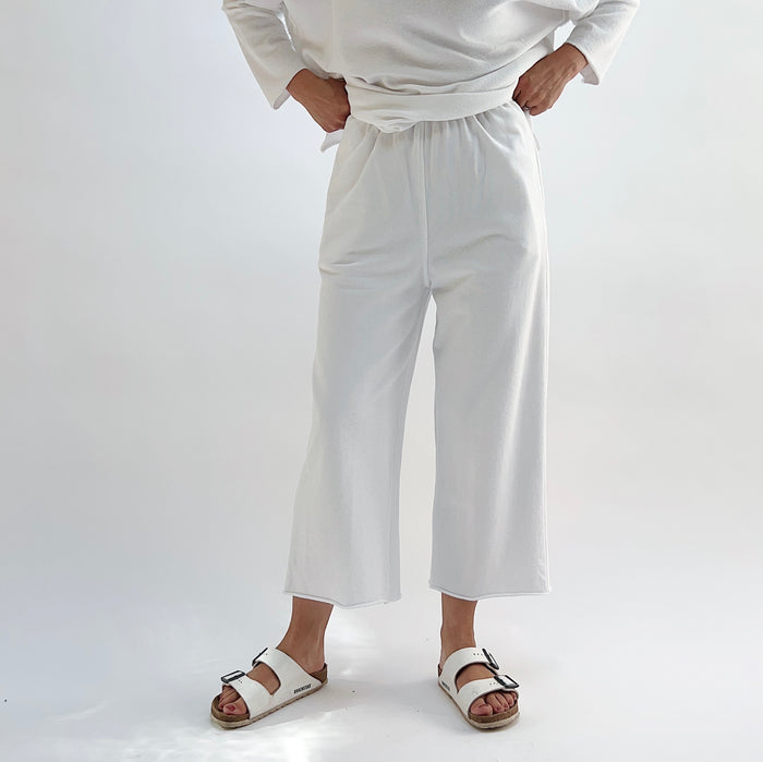 Rib Crop Pant in Chalk, front view showing high elastic waistband and wide-leg crop, styled with white sandals