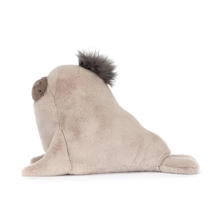 Side profile of Jellycat Roarwell Sea Lion showing the cream plush body, grey mane tuft, and elongated sea lion silhouette with rear flippers, on a white background