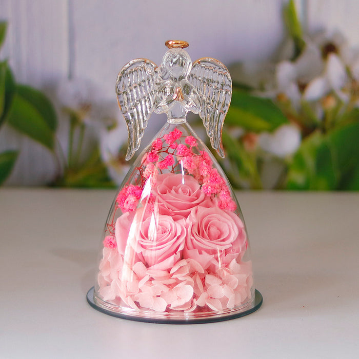 Rose keepsake gift shown from a side angle, highlighting the angel silhouette, glass element and decorative flower placement.