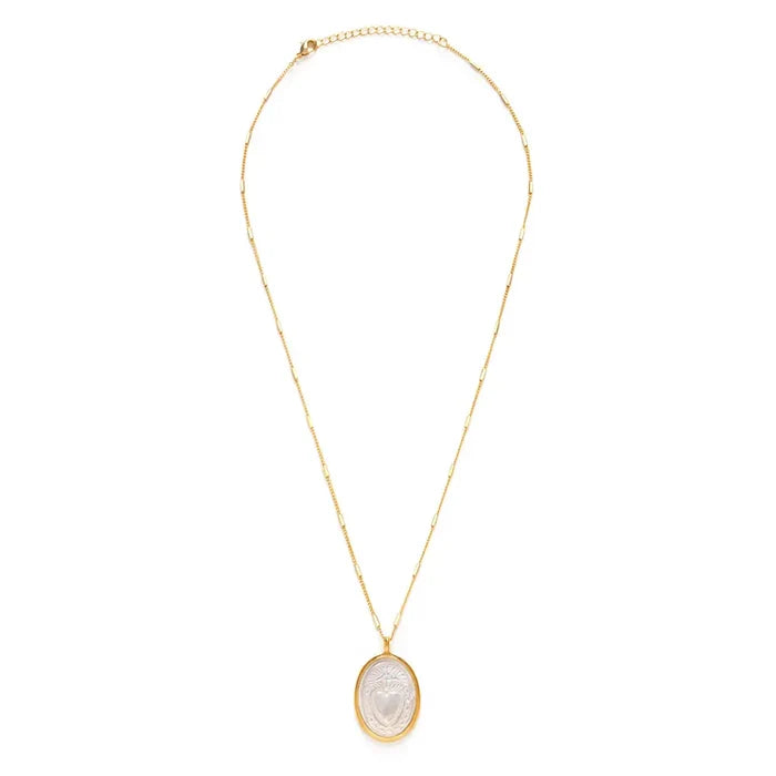 Gold necklace with a pendant on a white background
