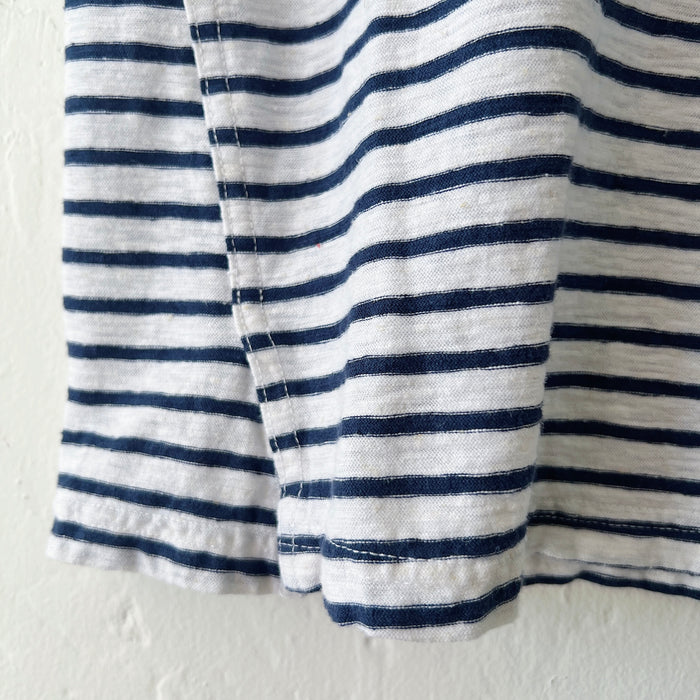 Close-up of the hem with navy and white striped fabric