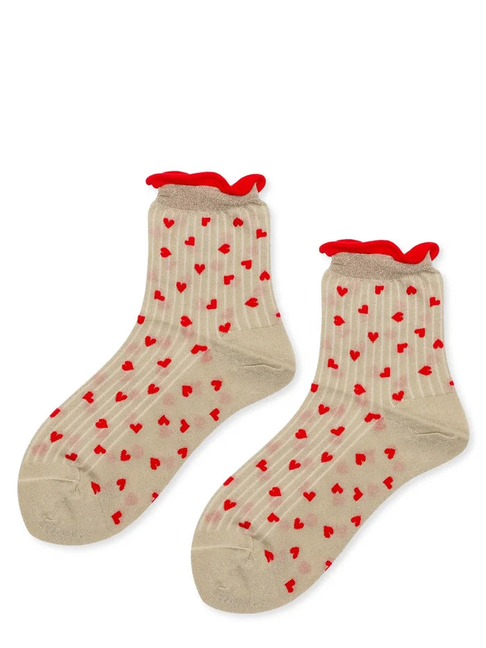Spiffy Hearts Short Crew socks in Ecru — sheer ecru ribbed nylon short crew with allover red heart motif and red ruffle cuff, flat lay pair on white background