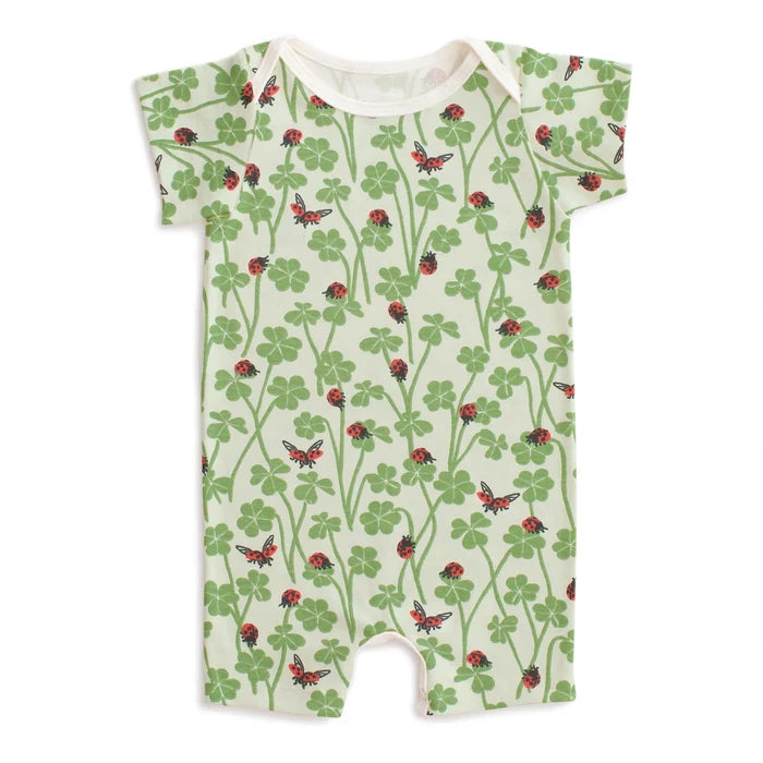 Baby romper with nature-themed print on a white background