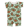 Baby romper with a monarch butterfly pattern on a green background