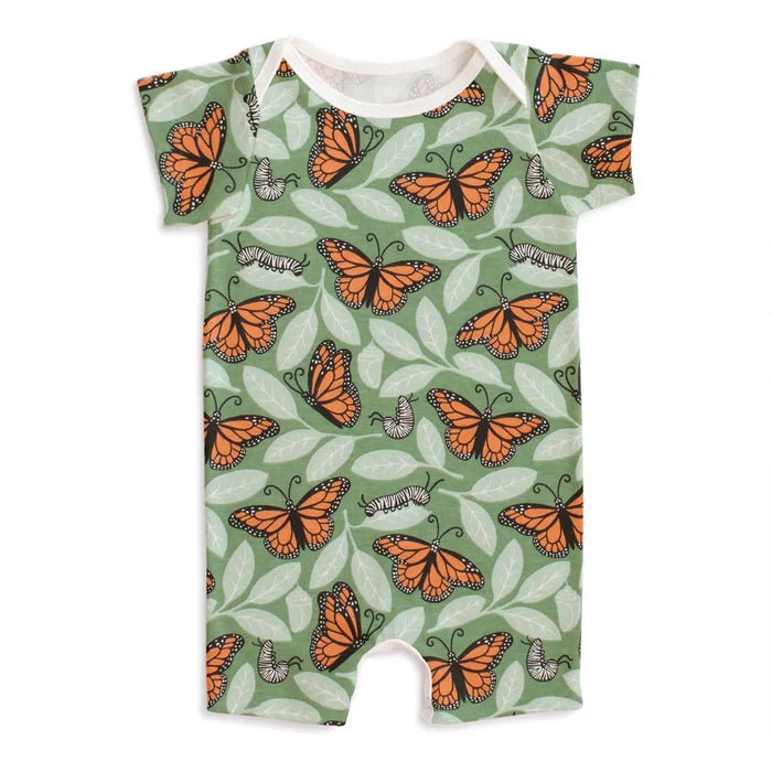 Baby romper with a monarch butterfly pattern on a green background