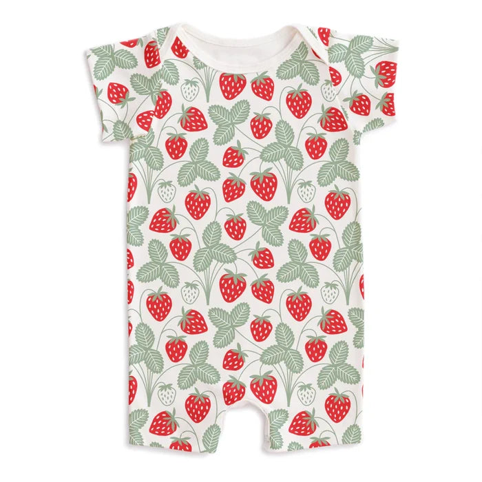 Summer romper in a red and green strawberry print on a whitebackground